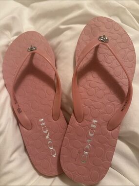 Pink Coach flip flops.